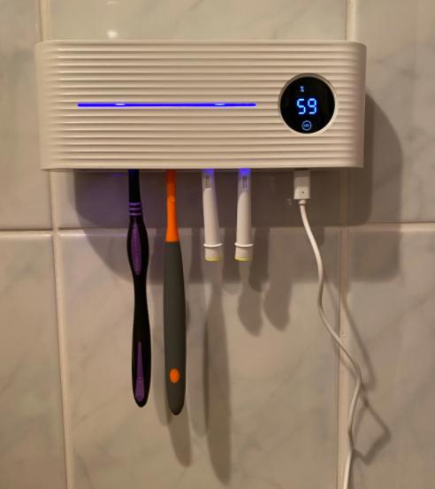 UV toothbrush steriliser with base and toothpaste dispenser