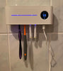 UV toothbrush steriliser with base and toothpaste dispenser